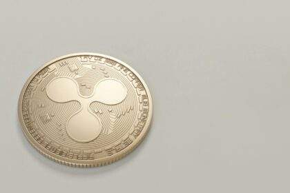 photo of round gold colored coin