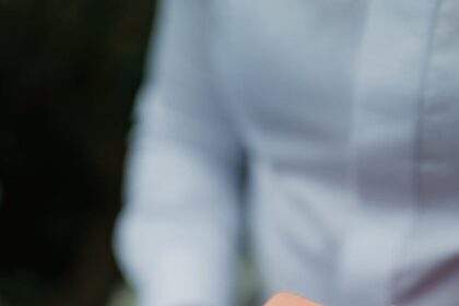 elegant ring in box held by person in white shirt