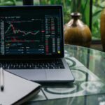 cryptocurrency chart displayed on a laptop