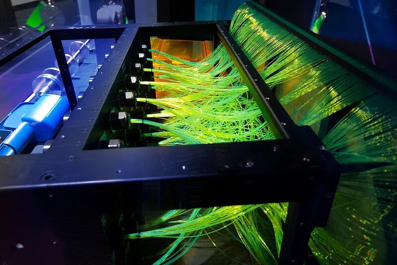What is the main difference between air-cooled and liquid-cooled miners?